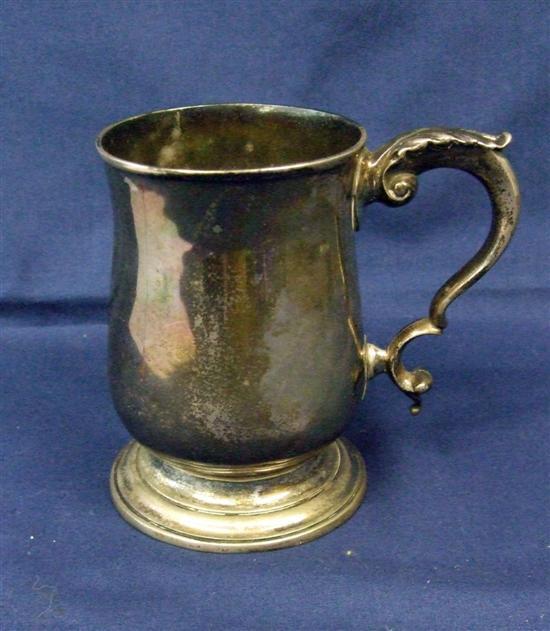 Appraisal: George III plain baluster silver mug with scroll handle London