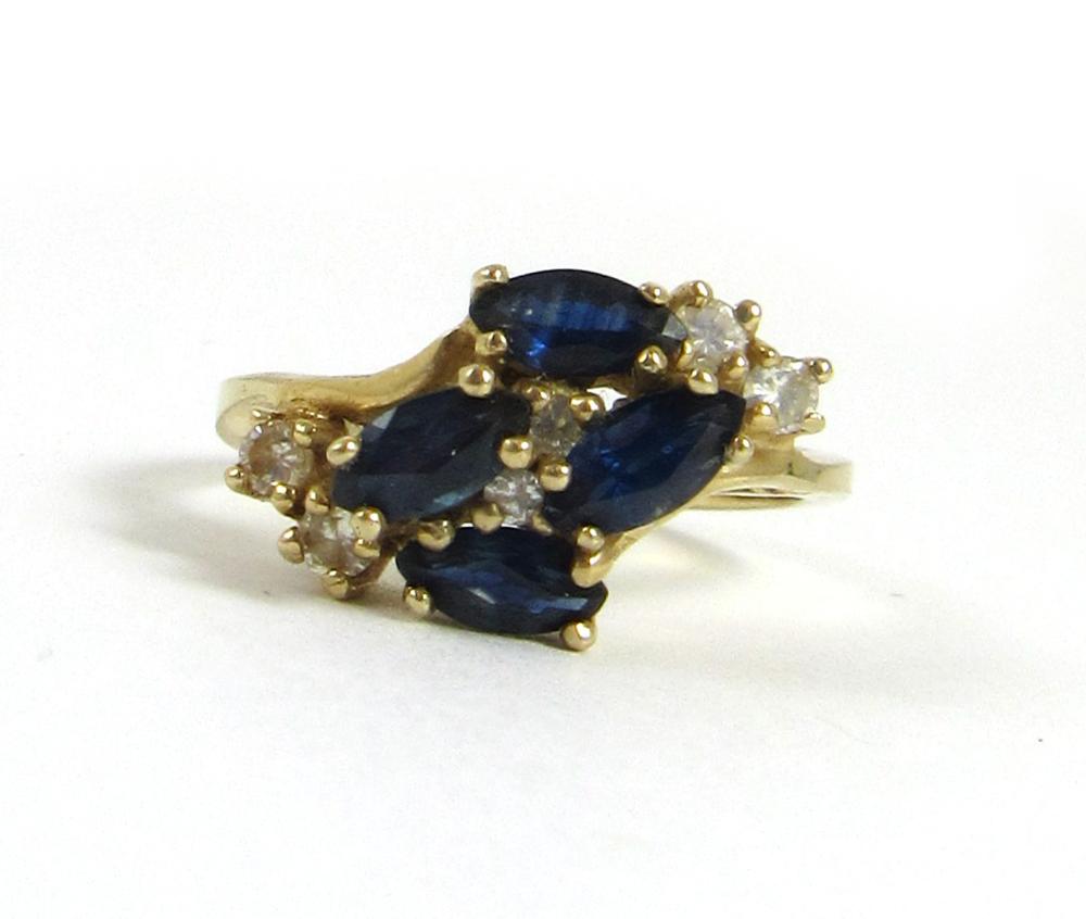 Appraisal: SAPPHIRE DIAMOND AND FOURTEEN KARAT GOLD RING set with four