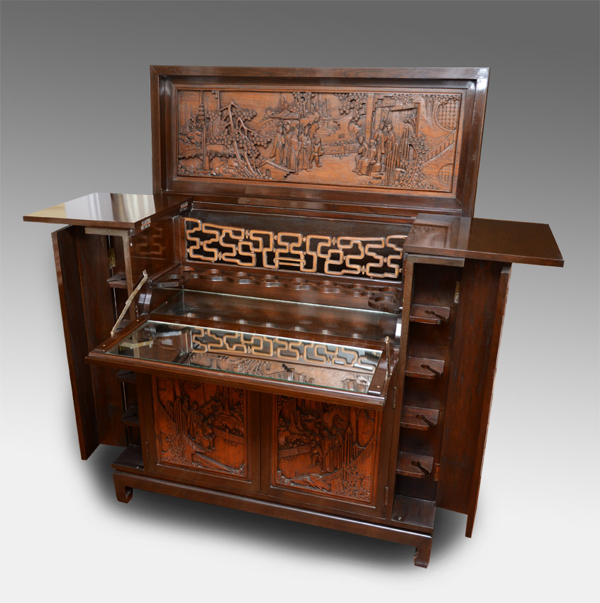 Appraisal: CARVED ORIENTAL LIFT TOP BAR Carved panels front and sides