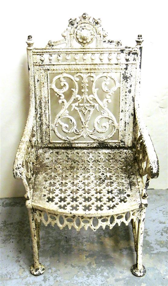 Appraisal: Victorian cast-iron garden arm chair painted white with elaborate floral