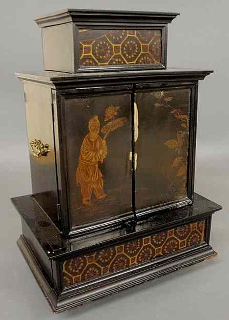 Appraisal: Asian black lacquered storage chest th c with brass handles