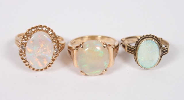 Appraisal: Three Lady's K gold rings set with opals sizes and