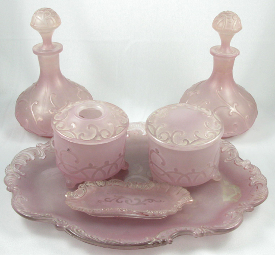 Appraisal: A SIX PIECE PINK GLASS DRESSER SET having a pair