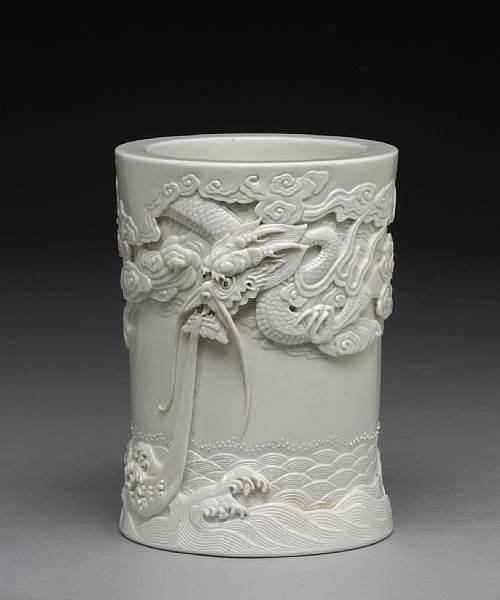 Appraisal: A white biscuit-glazed porcelain brush pot Daoguang Mark Of cylindrical