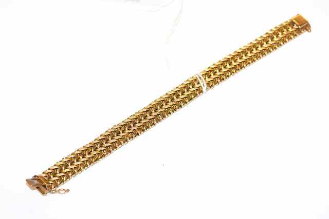 Appraisal: A CT GOLD BRACELET with four rows of interlocking links