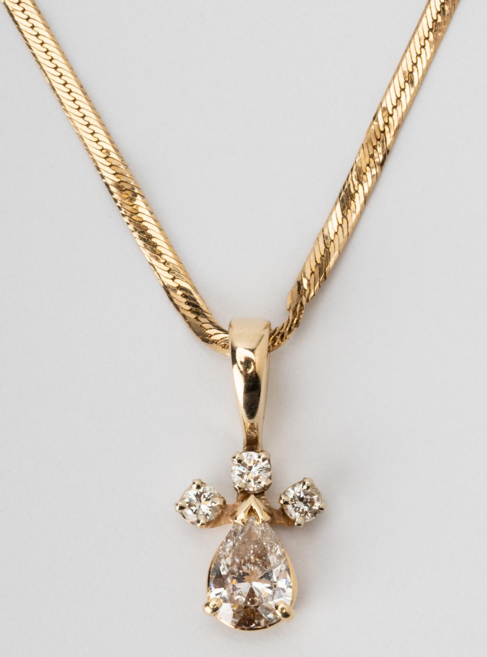 Appraisal: KARAT YELLOW GOLD DIAMOND NECKLACEThe pendant containing one pear shape