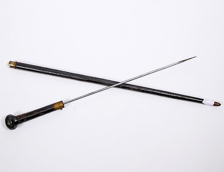 Appraisal: Sword Cane Early th Century- An ebonized handle and shaft