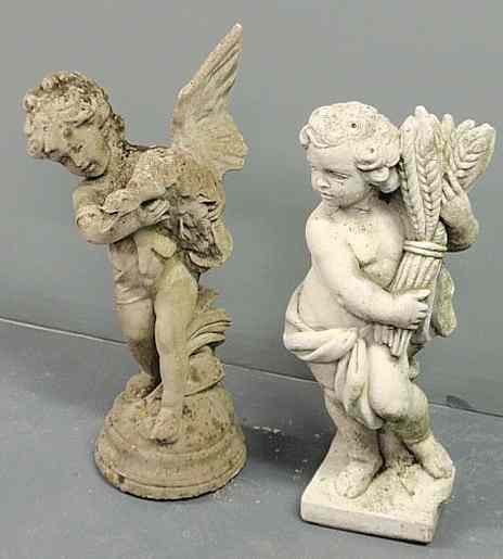 Appraisal: Two cast stone garden statues of children one holding a