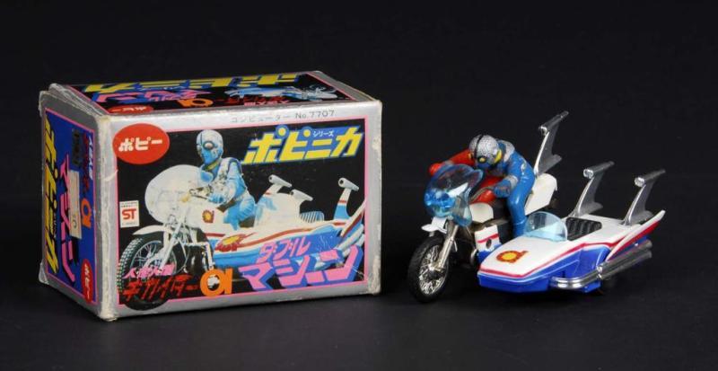 Appraisal: Popinika Mini Side Machine from Kikaider Description Japanese Made by