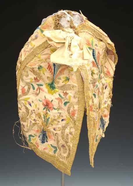 Appraisal: AN TH CENTURY SILK BONNET OF COIF with polychrome flower