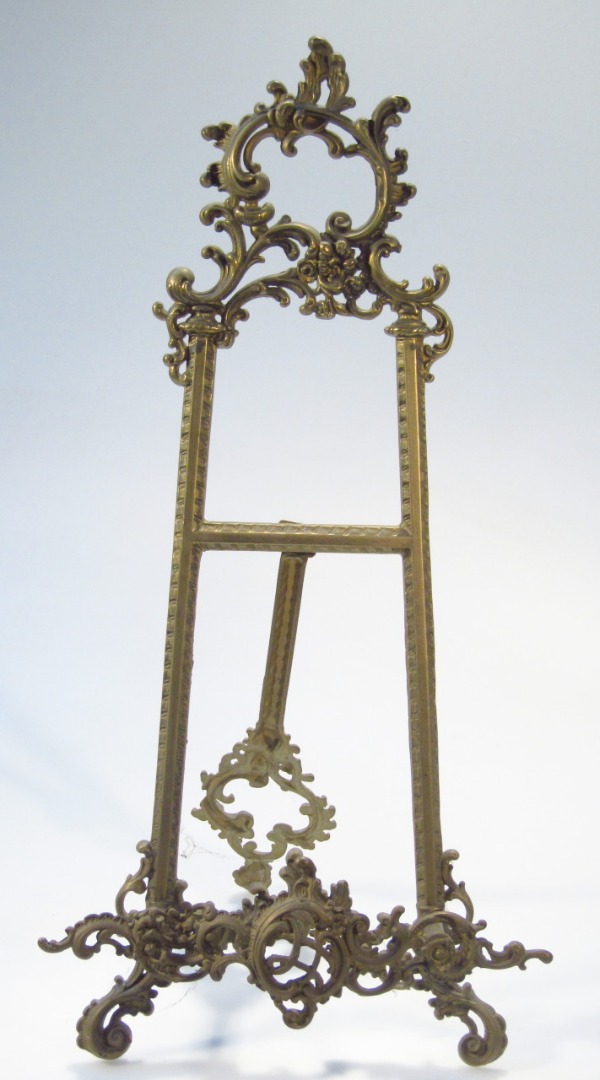 Appraisal: A thC style brass table easel in the rococo manner