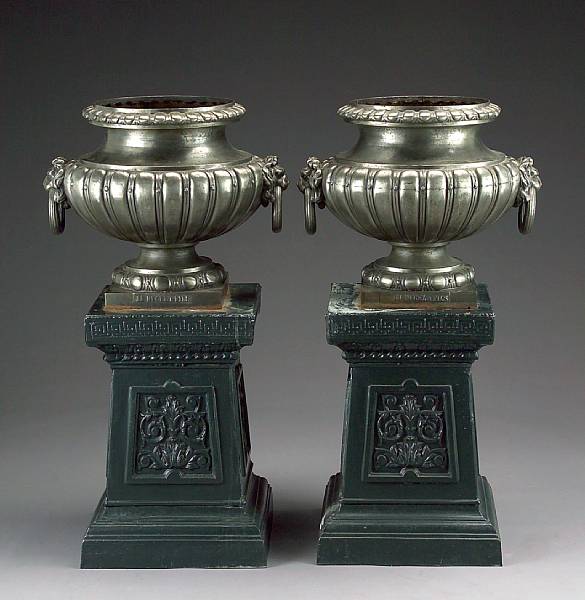 Appraisal: A pair of Neoclassical style painted cast iron pedestals Each