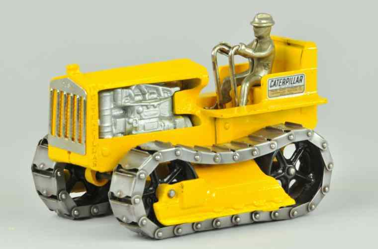 Appraisal: ARCADE CATERPILLAR TRACTOR c 's cast iron painted in yellow