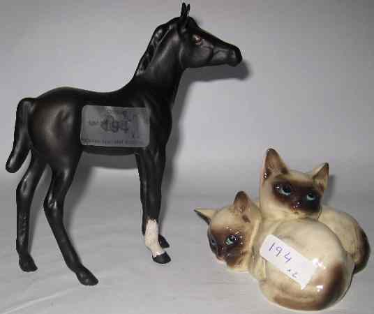 Appraisal: Royal Doulton Siamese Kittens Lying and Royal Doulton Black Beauty