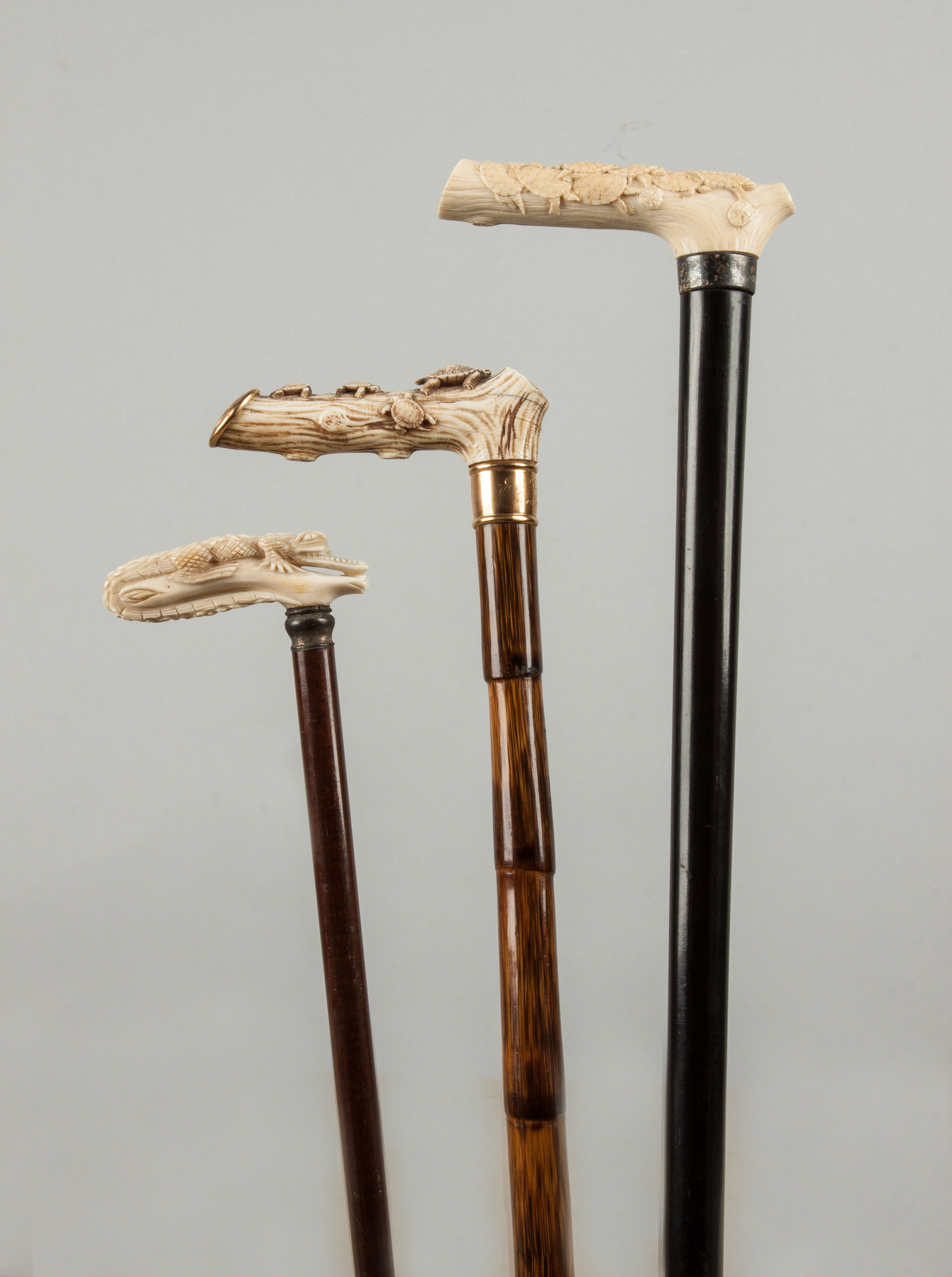 Appraisal: Three Wood Canes with Carved Handles Late th early th