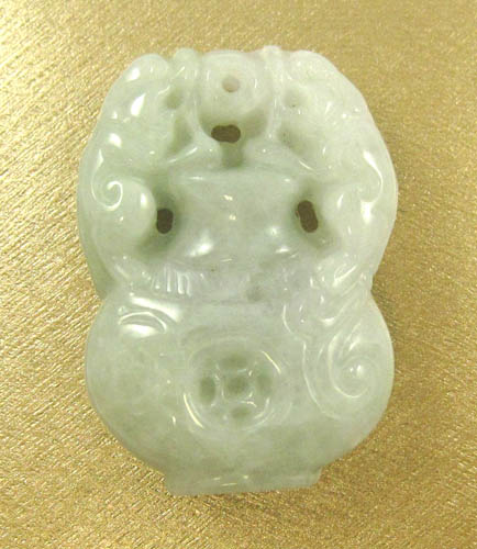 Appraisal: CHINESE CARVED JADE PENDANT weighing grams The light green jade