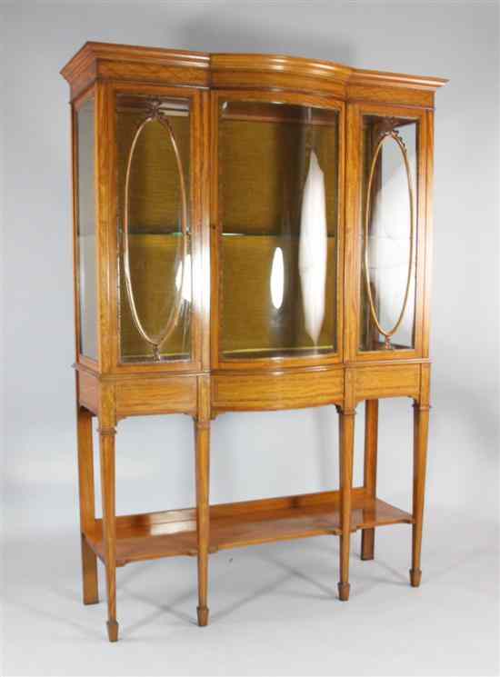 Appraisal: An Edwardian inlaid satinwood display cabinet with central curved door