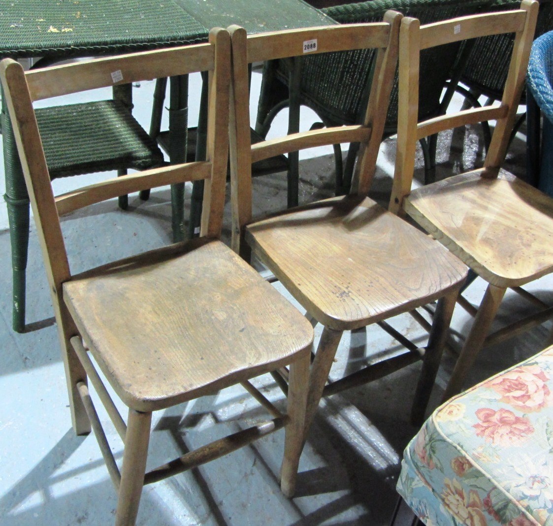 Appraisal: A group of three pine dining chairs