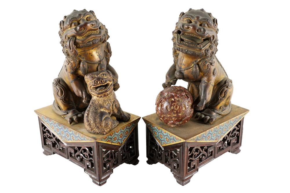 Appraisal: PAIR OF GILT METAL FOO LIONSone with a carved wood