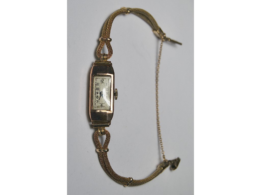 Appraisal: ct yellow gold rectangular wristwatch on ct yellow gold cord