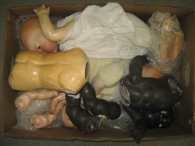 Appraisal: An AM bisque head black baby doll to restring two