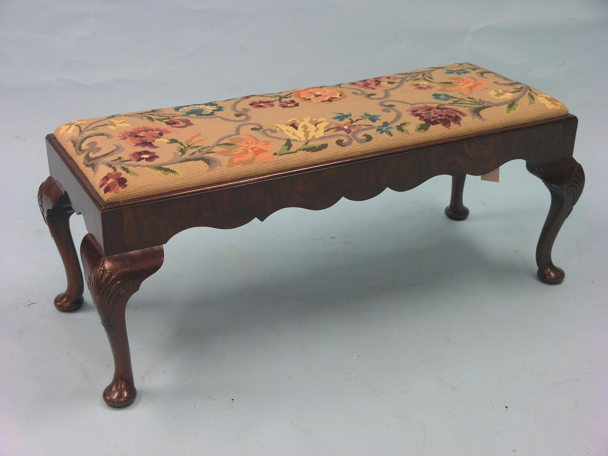 Appraisal: A walnut long stool with drop-in petit-point tapestry seat on