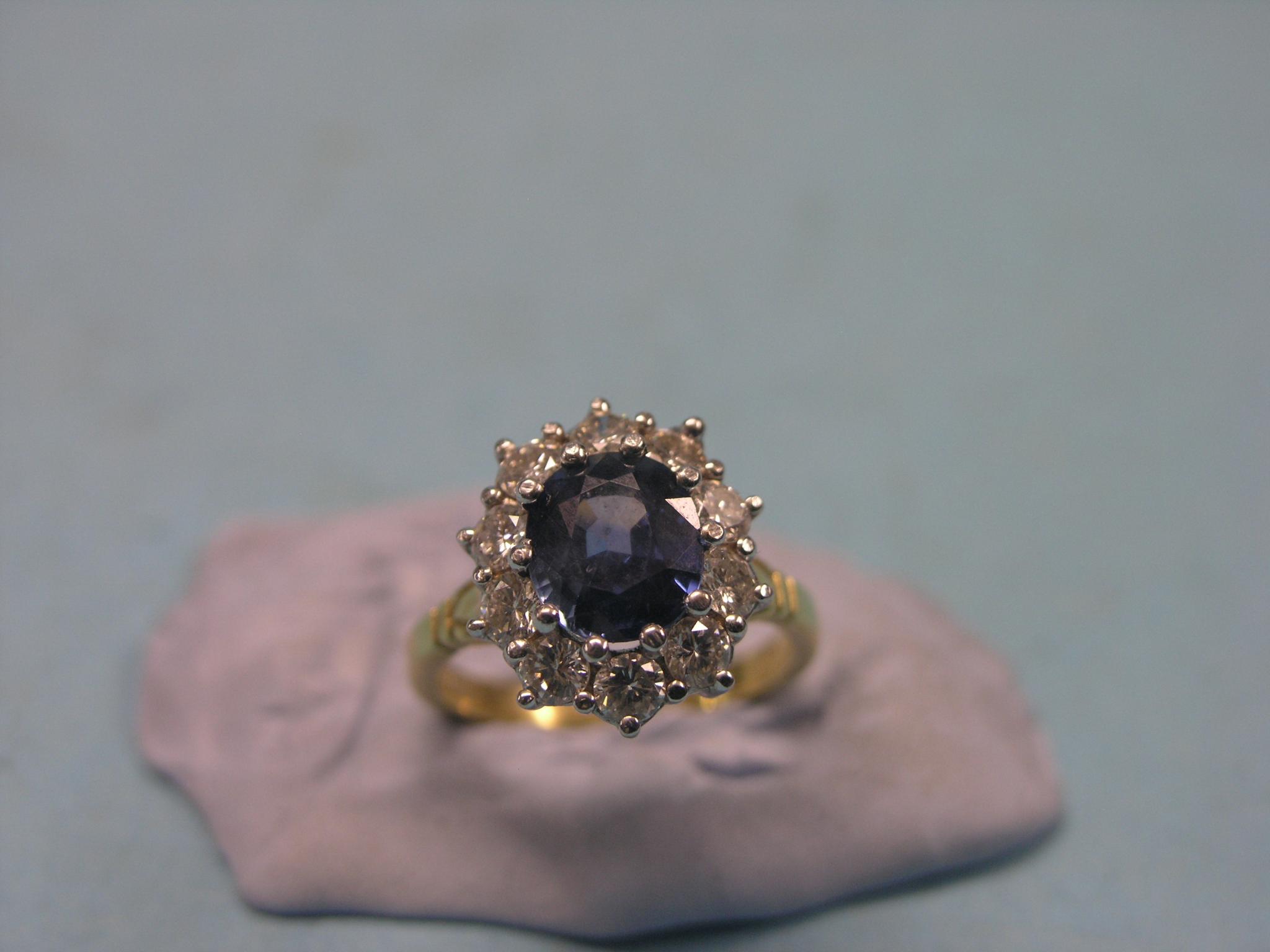 Appraisal: An ct gold diamond and blue stone cluster ring claw