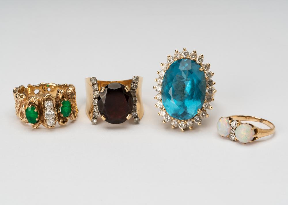 Appraisal: GROUP OF FOUR ASSORTED KARAT YELLOW GOLD GEM-SET DIAMOND RINGSone