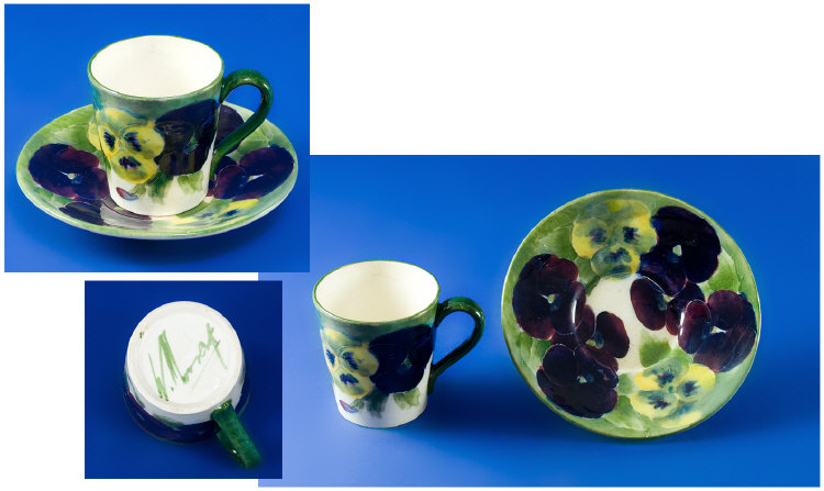 Appraisal: Miniature Moorcroft Cup and Saucer Set in the 'Rare Pansy'