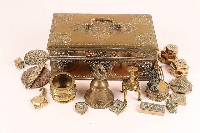 Appraisal: AN INDIAN ENGRAVED BRASS RECTANGULAR BOX with hinged rising lid