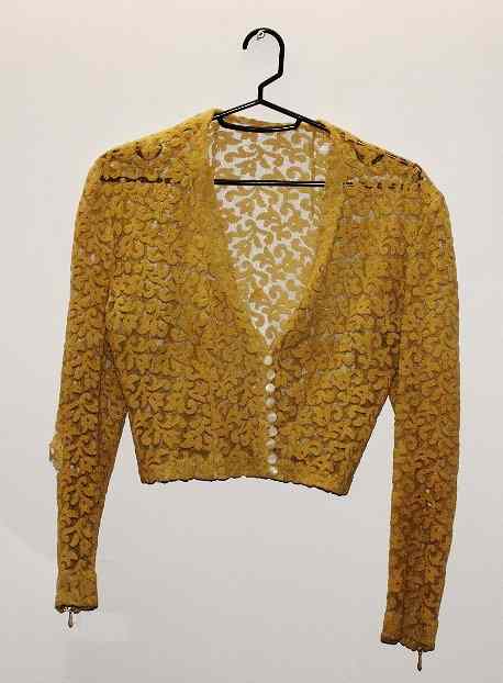 Appraisal: A CHRISTIAN DIOR YELLOW LACE JACKET label missing hole to