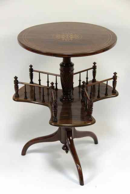 Appraisal: An Edwardian rosewood book table on a tripod base cm