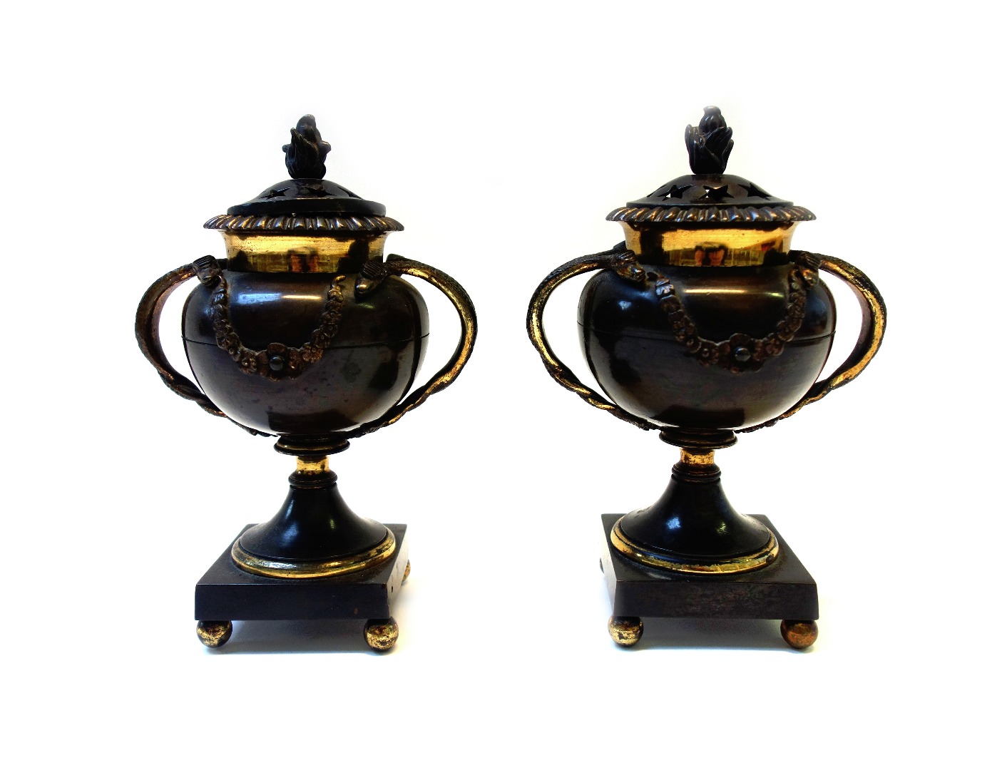 Appraisal: A pair of Regency pierced bronze and gilt perfume burners