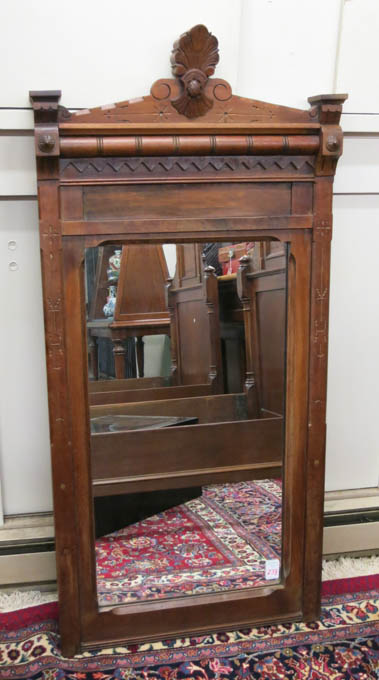 Appraisal: A VICTORIAN WALNUT FRAMED WALL MIRROR Eastlake design American c