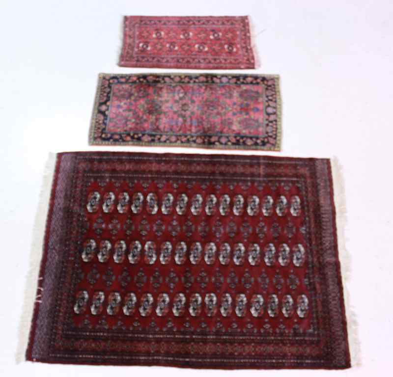 Appraisal: THREE ORIENTAL RUGS INCLUDING TWO BOKHARAS AND A SAROUK the