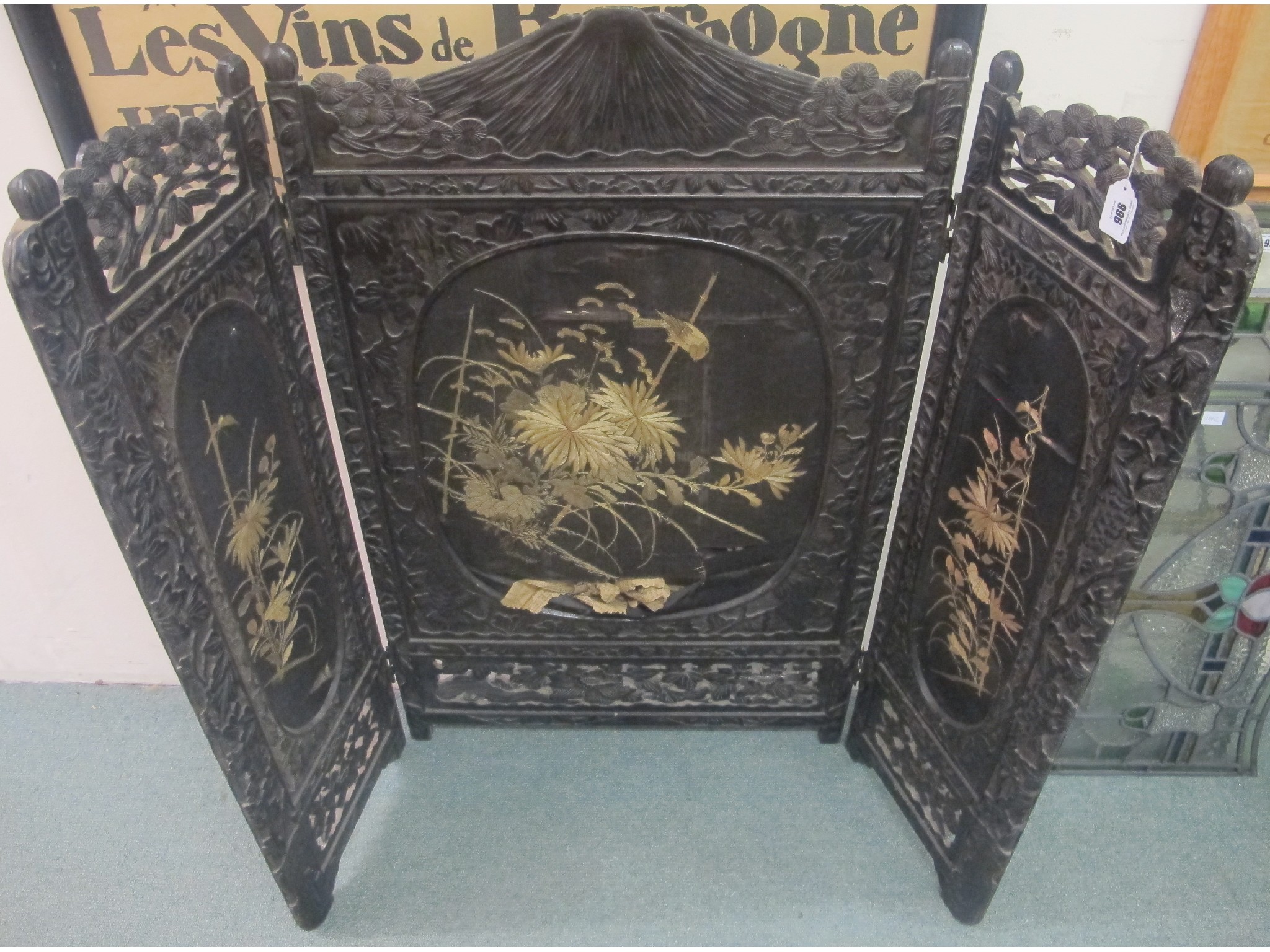 Appraisal: A Japanese carved and silk three-fold fire screen