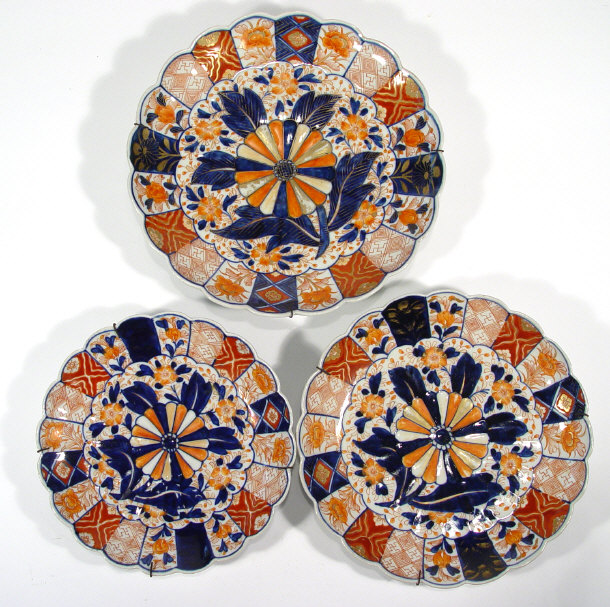 Appraisal: Three Japanese Imari graduated porcelain plates of fluted form painted