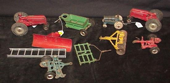 Appraisal: Two arcade cast iron tractors a cast iron tractor six