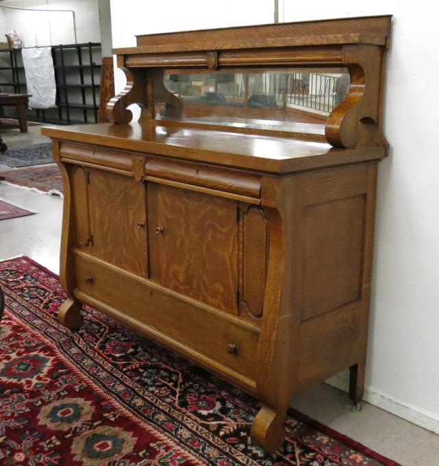 Appraisal: AMERICAN OAK SIDEBOARD Empire Revival style Rockford Chair Furniture Co