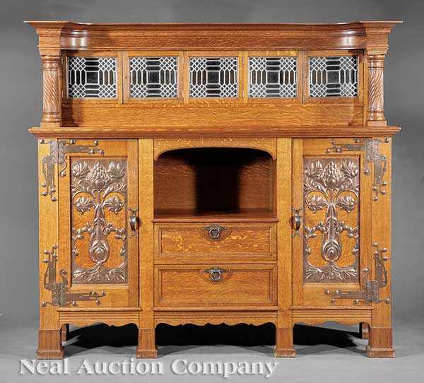 Appraisal: An English Arts and Crafts Carved Oak and Chased Copper