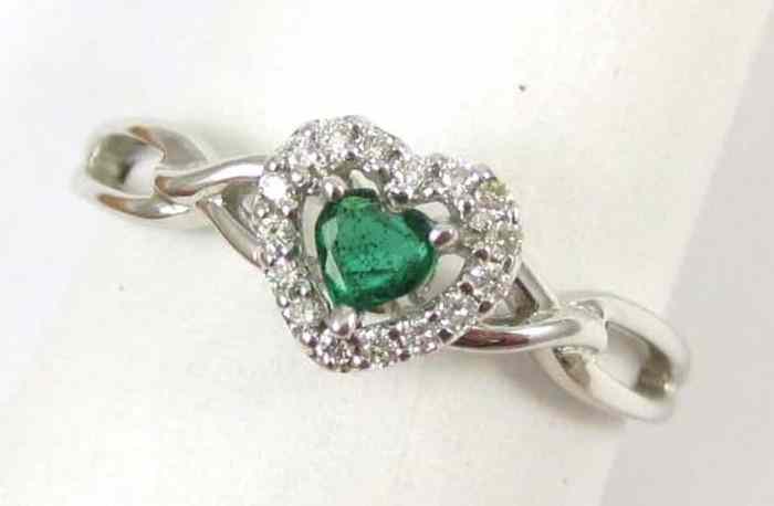 Appraisal: EMERALD DIAMOND AND FOURTEEN KARAT GOLD RING The white gold