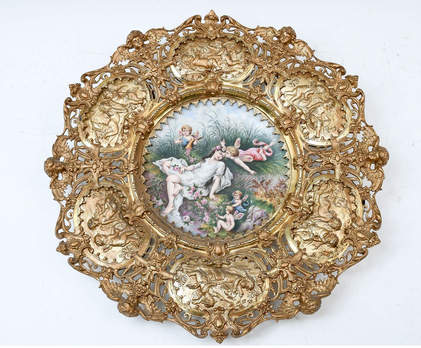 Appraisal: PAINTED CHARGER IN BRONZE FIGURAL FRAME Figural painted charger mounted