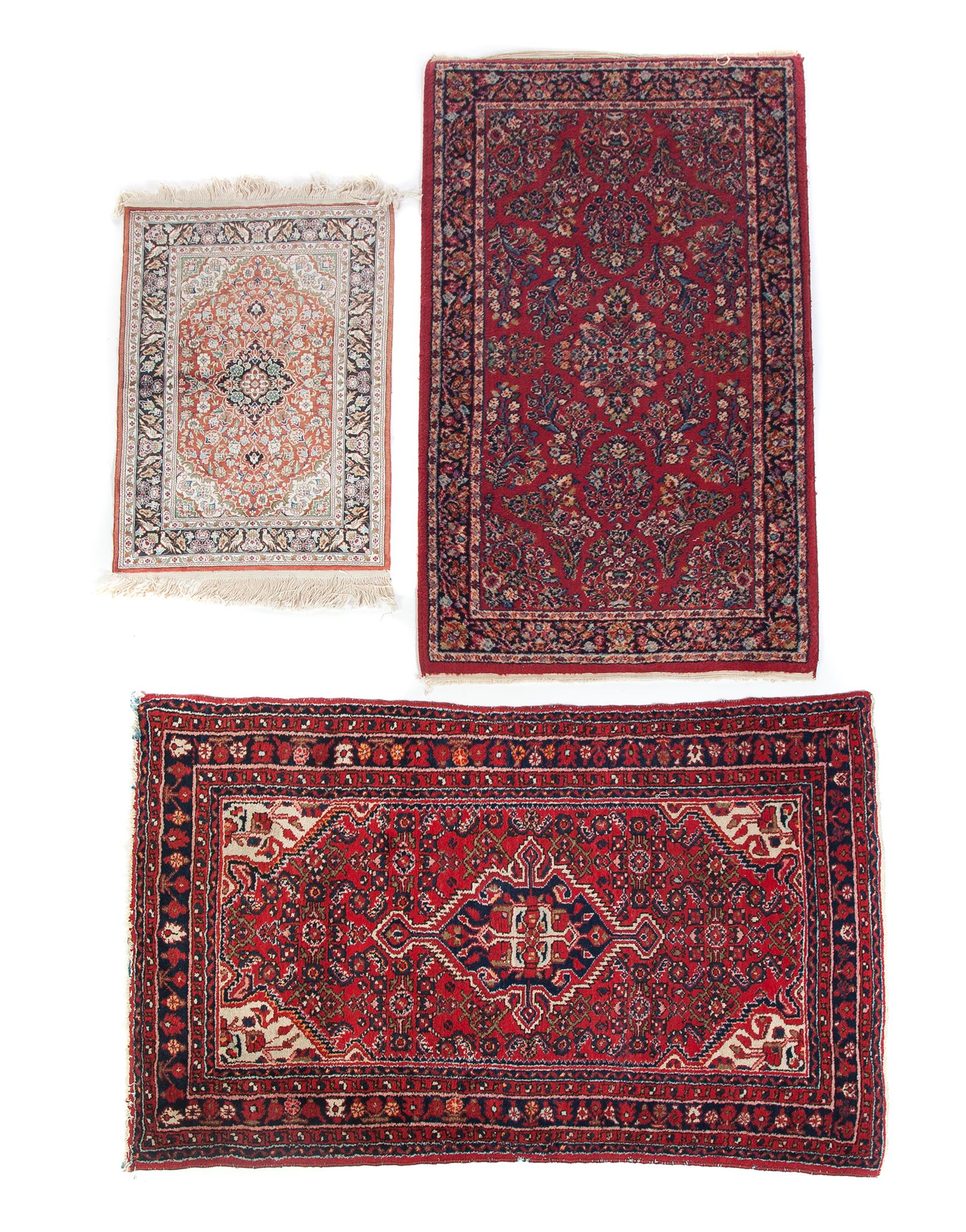 Appraisal: THREE ORIENTAL AREA RUGS Twentieth century Floral pattern in bright