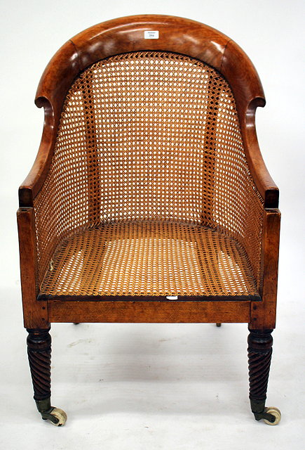 Appraisal: A TH CENTURY MAHOGANY FRAMED BERGERE CHAIR with curving back