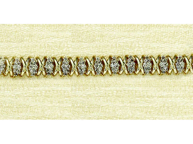 Appraisal: DIAMOND BRACELET k yellow gold bracelet with alternating diamond and