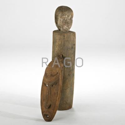 Appraisal: ETHNOGRAPHIC WOOD CARVINGS Sepick River mask and a slit drum