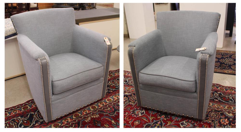 Appraisal: PAIR OF LIGHT BLUE UPHOLSTERED SWIVEL ARMCHAIRS made by Leathercraft