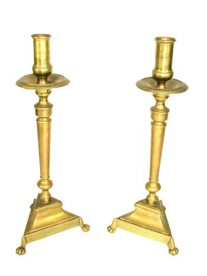 Appraisal: A pair of Dutch brass candlesticks on turned columnar supports