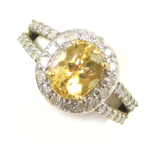 Appraisal: CITRINE DIAMOND AND TEN KARAT GOLD RING with round-cut diamond