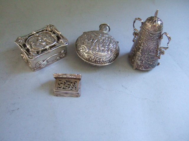 Appraisal: A silver rectangular pomander box the cover decorated with figures